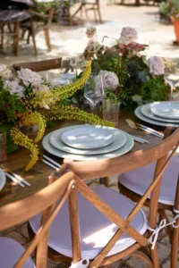 Rustic wedding table with blush roses and lilac chairs, styled by Classic Crockery